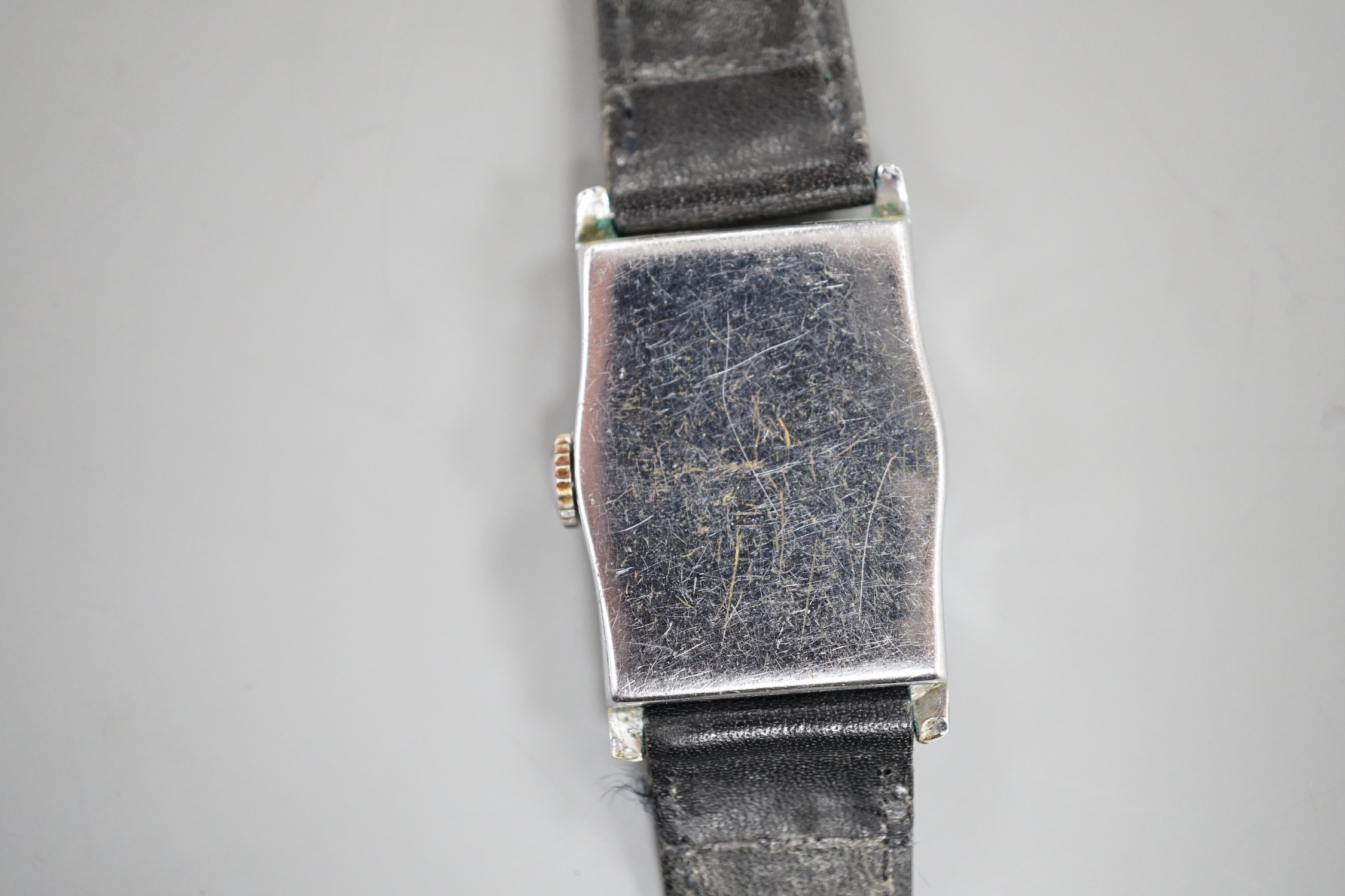 A gentlemen's 1930's? stainless steel jump hour digital manual wind wristwatch, on leather strap.